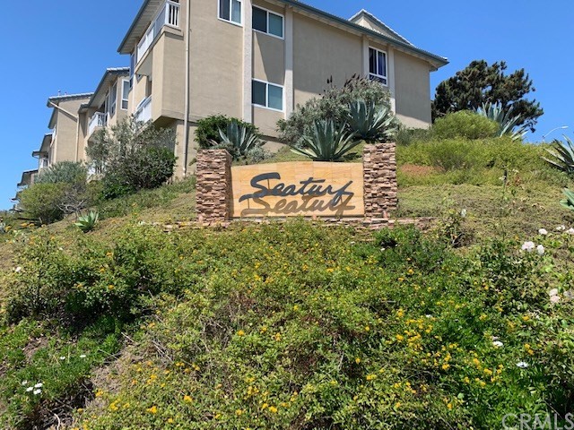 a view of a sign in front of house
