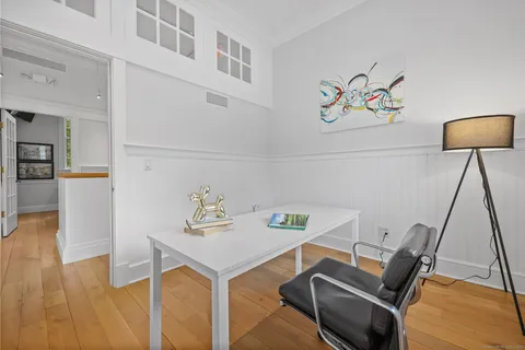 a view of workspace with wooden floor