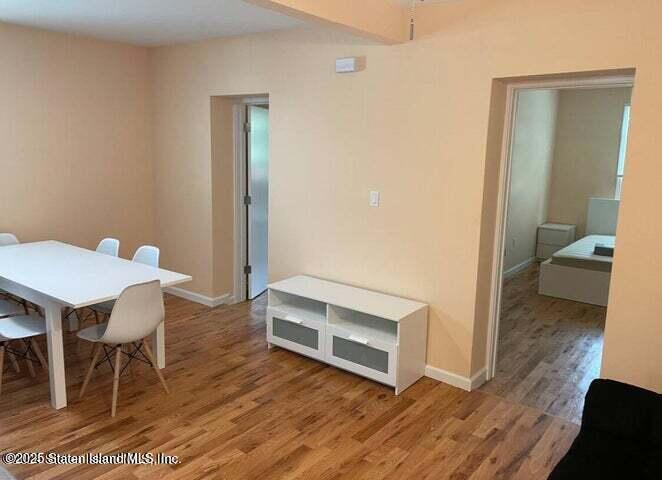 173 Clove Road Staten Island, NY 10310 - Photo 5 of 11 a view of a room that has a table and chairs in it