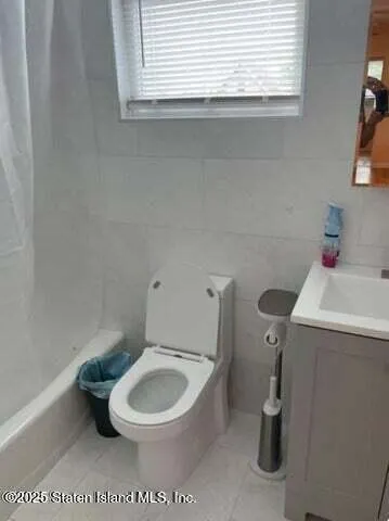 a view of a couches in patio of back yard