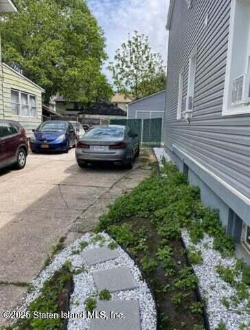 173 Clove Road Staten Island, NY 10310 - Photo 10 of 11 a view of a couches in patio of back yard