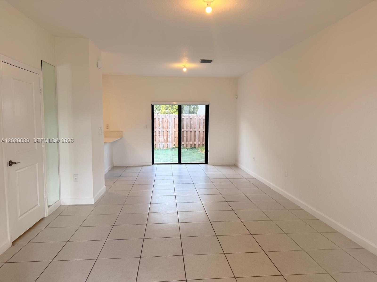 12875 Southwest 231st Terrace Miami, FL 33170 - Photo 4 of 25 a view of an empty room and window