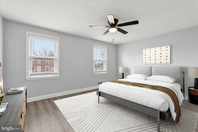 a bedroom with a large bed and a window