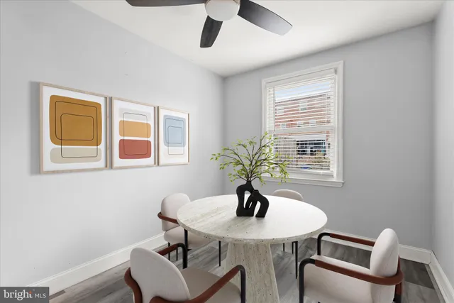 a view of a dining room with furniture and window