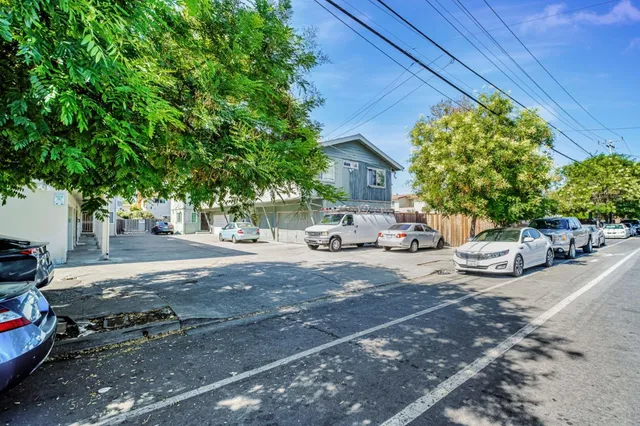 a view of street with parked cars