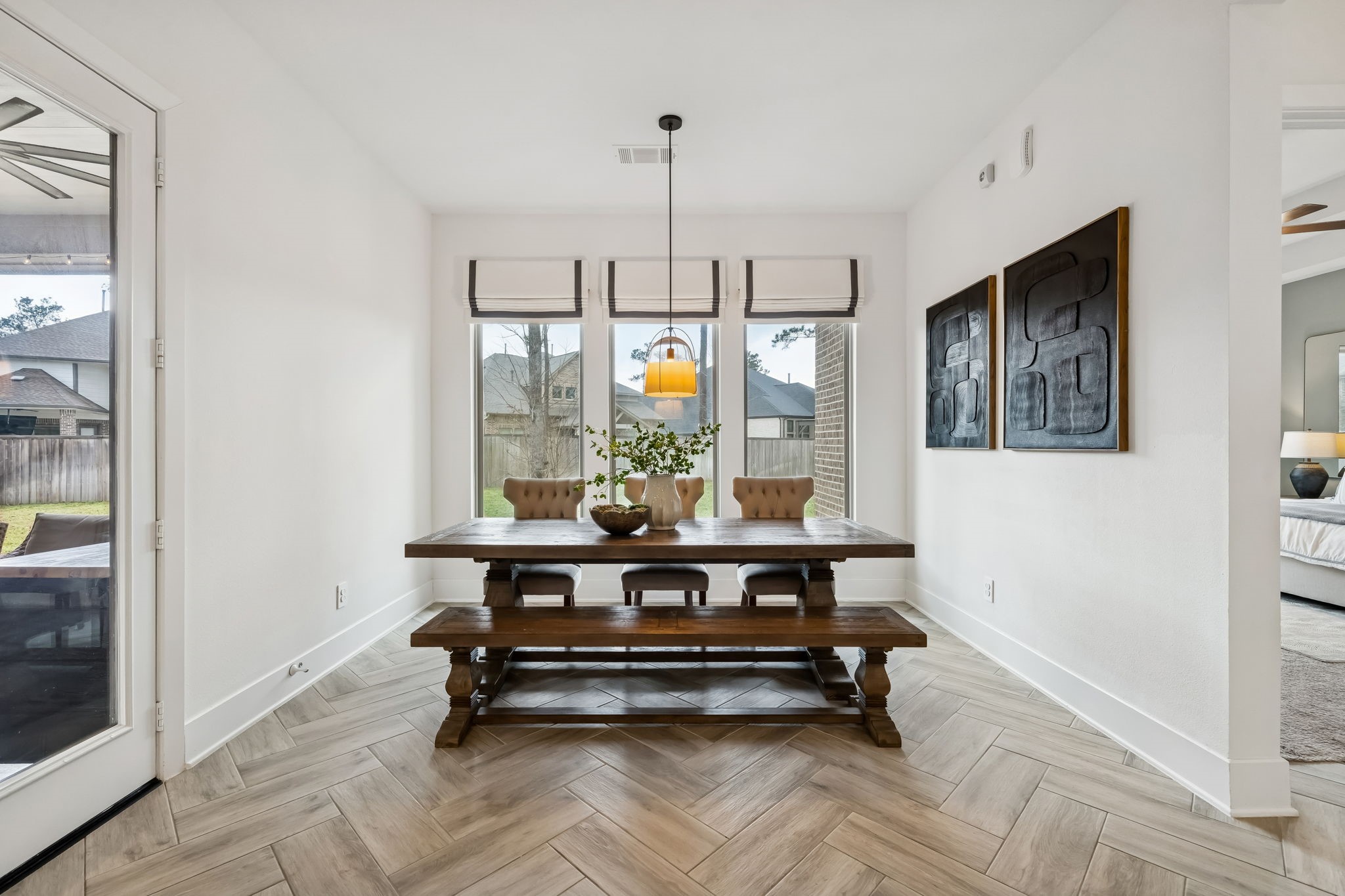 519 Caverna Street Montgomery, TX 77316 - Photo 12 of 41 Large windows overlook the backyard, while Rejuvenation lighting adds a refined touch.