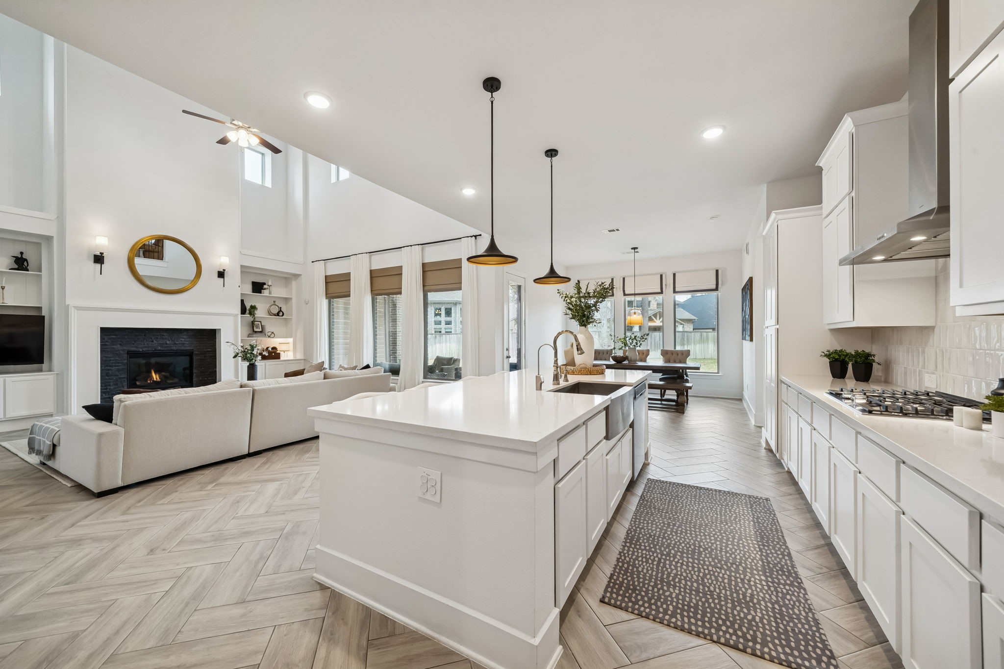 519 Caverna Street Montgomery, TX 77316 - Photo 13 of 41 The kitchen’s cooking area features a gas cooktop with vent hood, 42” upper cabinetry and generous counter space to prep.