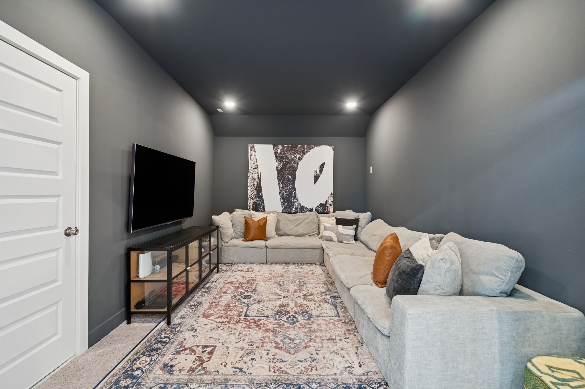 519 Caverna Street Montgomery, TX 77316 - Photo 26 of 41 The media room creates a dedicated space for movie nights, game days, or relaxing with your favorite shows.