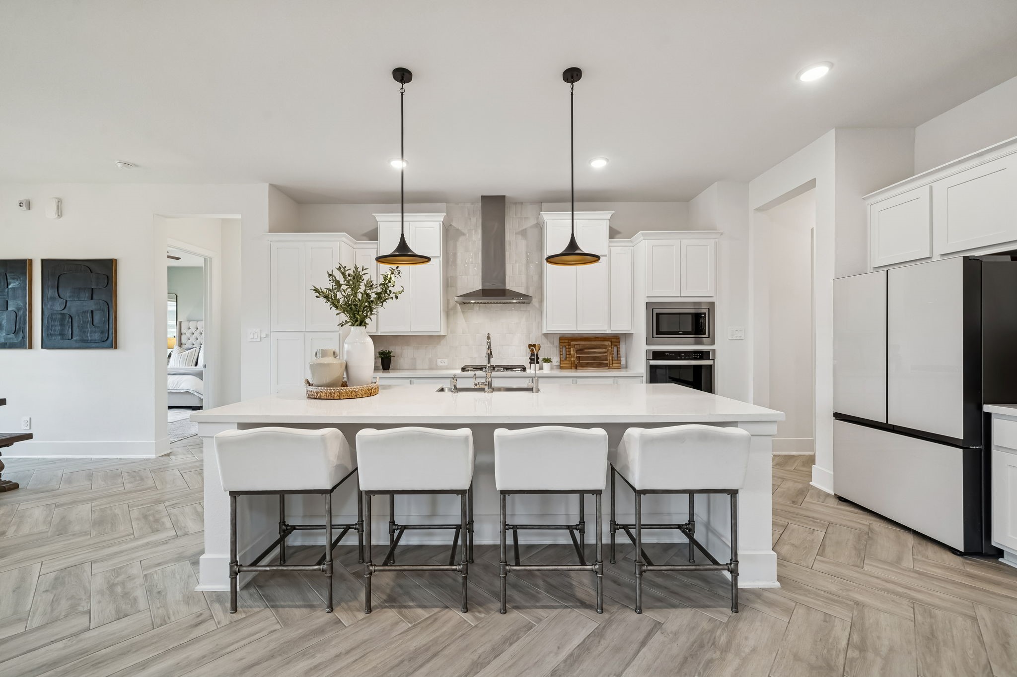 519 Caverna Street Montgomery, TX 77316 - Photo 3 of 41 Centered around an oversized island with seating, the kitchen naturally becomes the hub of the home, perfect for morning coffee, casual meals, or visiting while cooking.