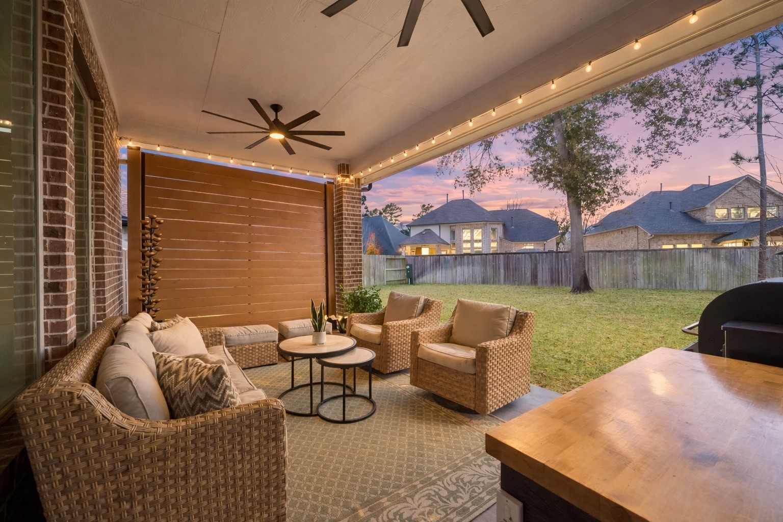 519 Caverna Street Montgomery, TX 77316 - Photo 31 of 41 A natural extension of the living spaces, the covered patio with privacy wall overlooks the expansive yard.