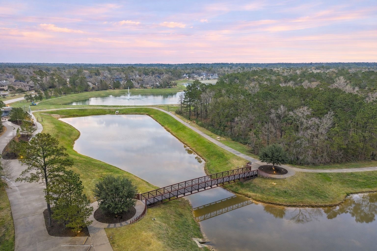 519 Caverna Street Montgomery, TX 77316 - Photo 36 of 41 Miles of scenic walking and biking trails wind through the neighborhood, connecting parks, lakes, and green spaces making it easy to enjoy the outdoor lifestyle Woodforest is known for.