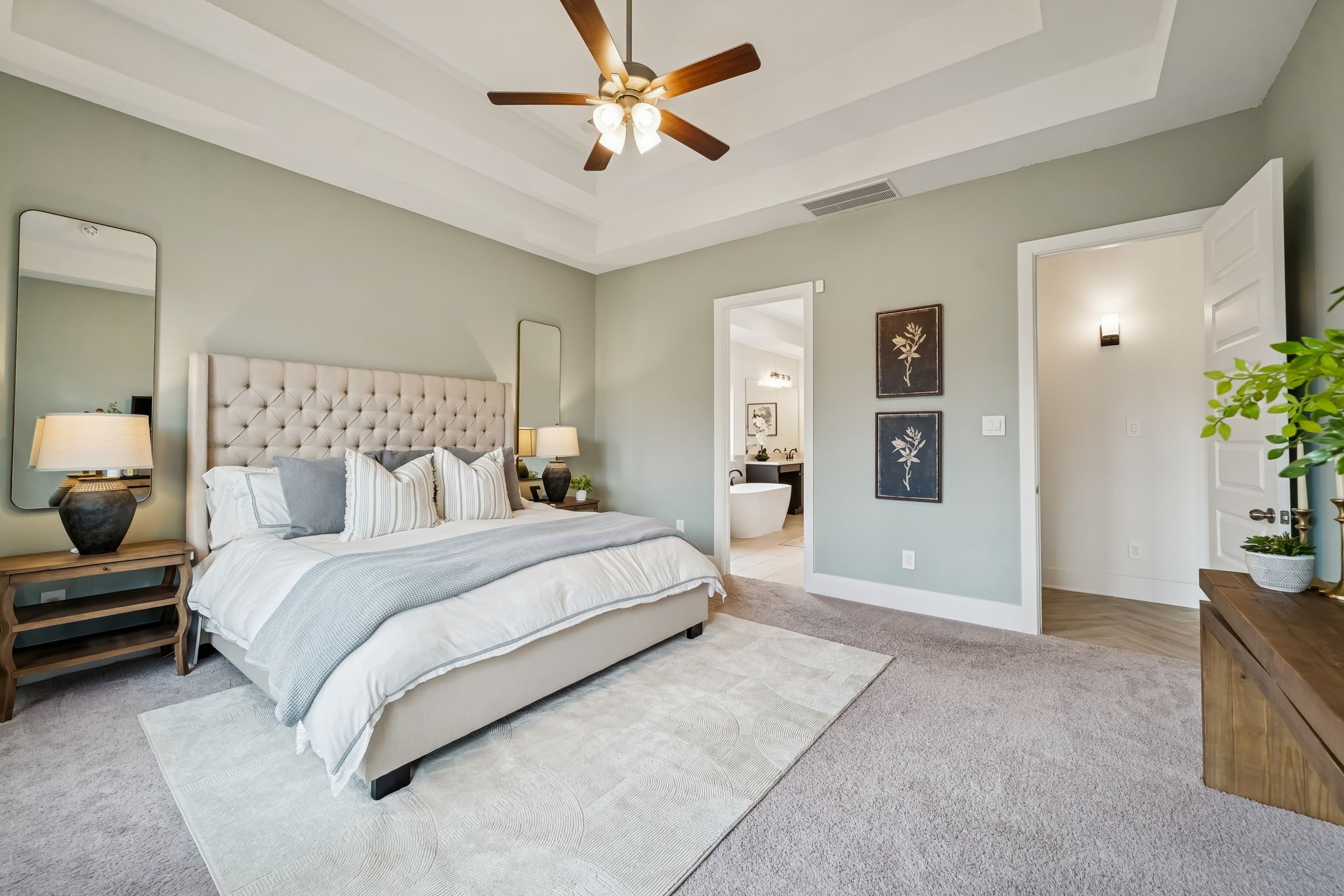 519 Caverna Street Montgomery, TX 77316 - Photo 4 of 41 The first floor primary suite features tray ceilings and a spacious layout.