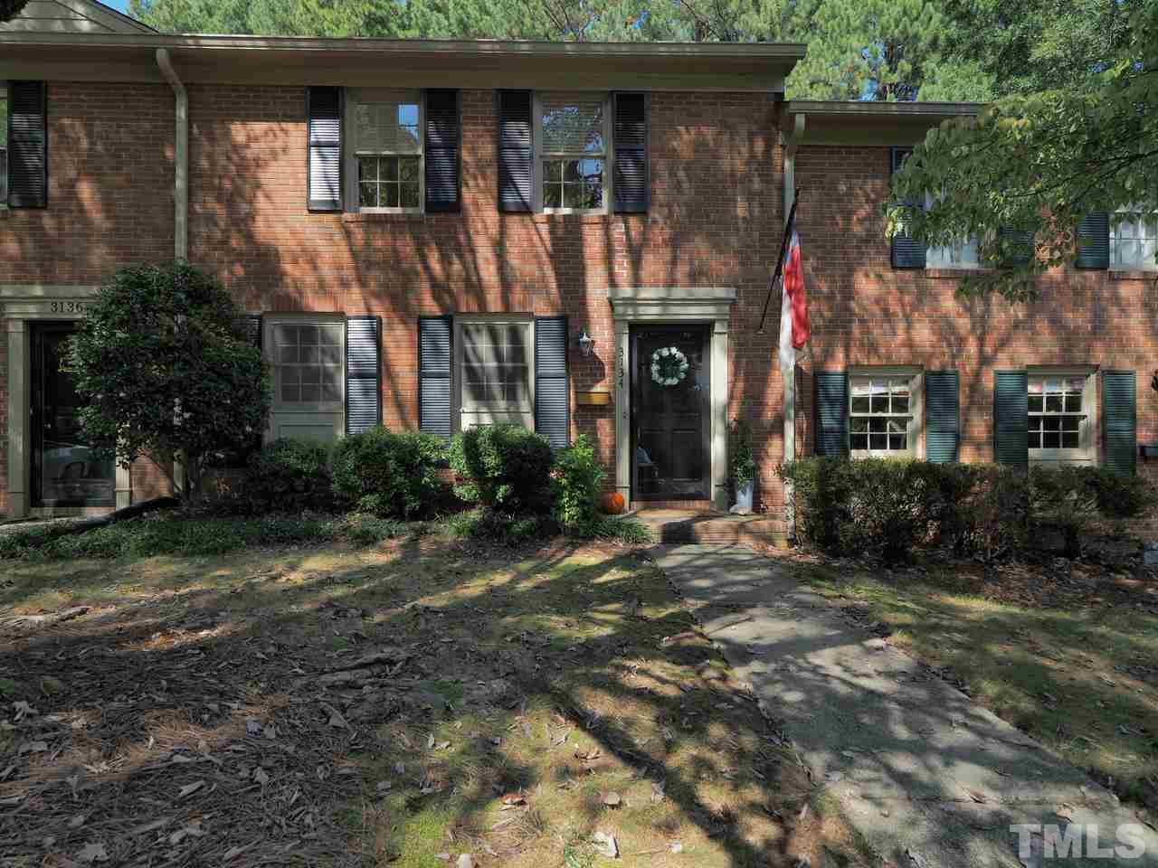 3134 Morningside Drive Raleigh, NC 27607 - Photo 1 of 22 a front view of a house with a yard
