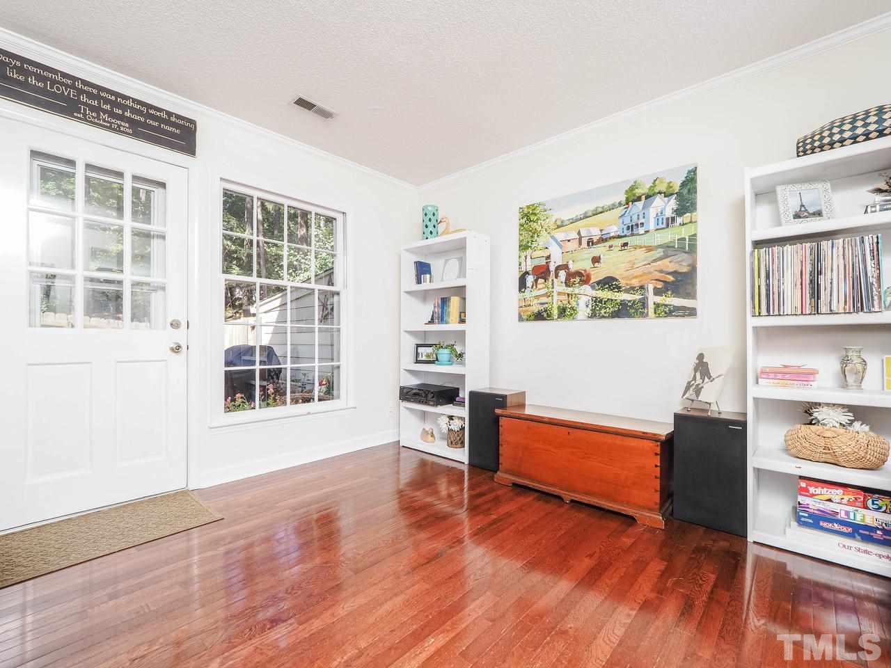 3134 Morningside Drive Raleigh, NC 27607 - Photo 11 of 22 a living room with furniture and a wooden floor