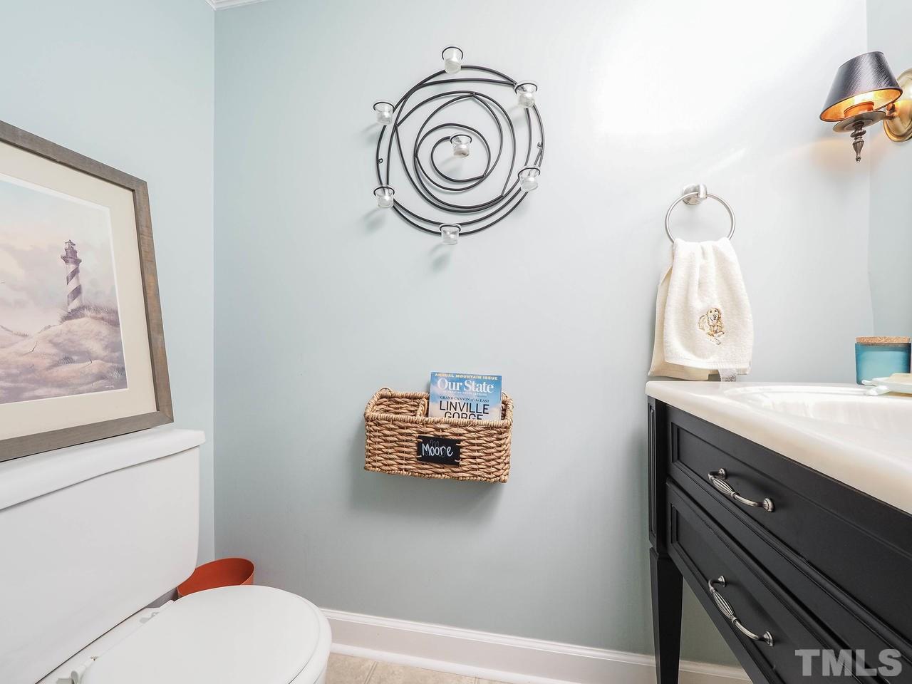 3134 Morningside Drive Raleigh, NC 27607 - Photo 12 of 22 a bathroom with a sink a toilet and a mirror