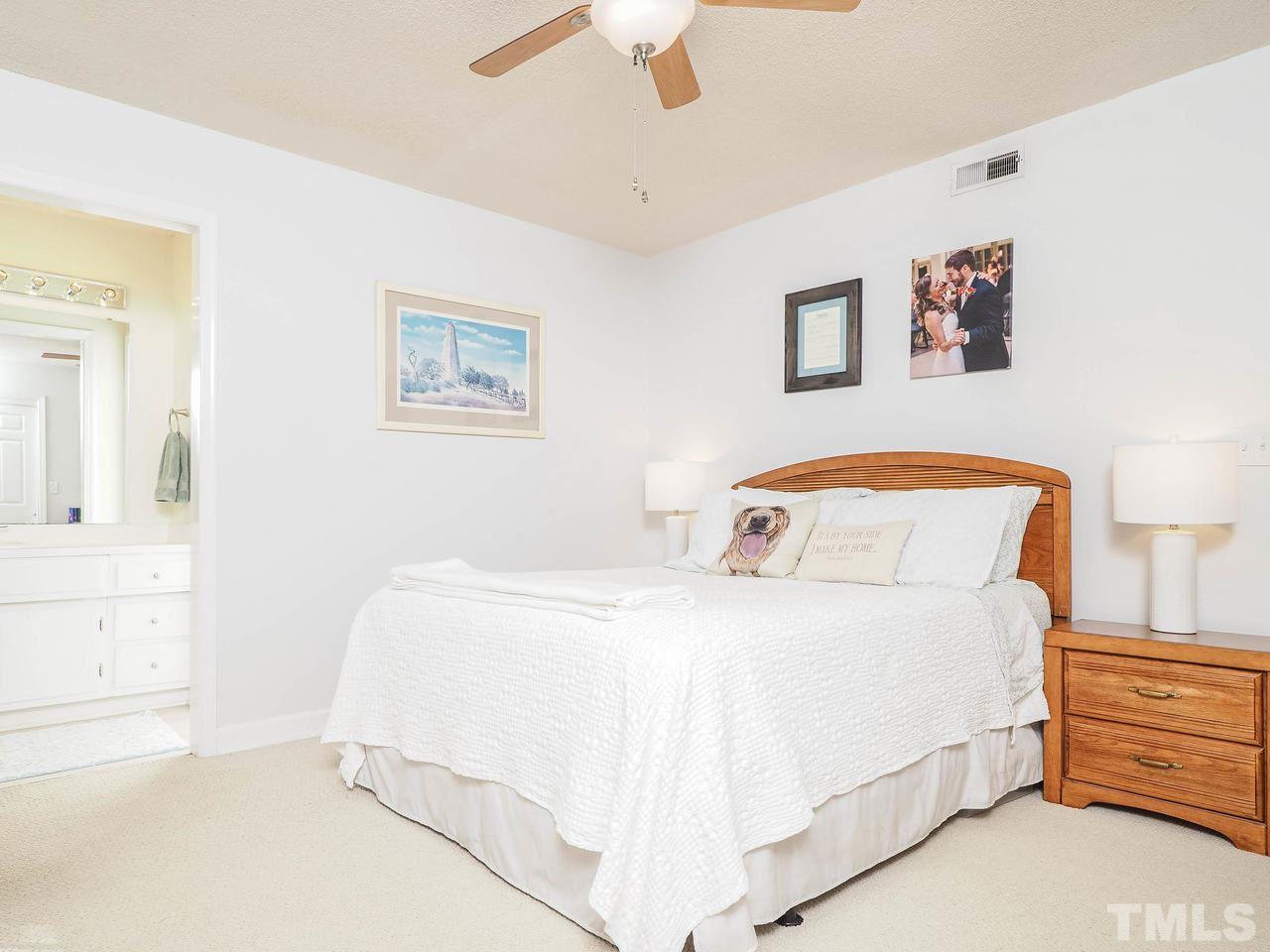3134 Morningside Drive Raleigh, NC 27607 - Photo 14 of 22 a bedroom with a bed and a cabinets