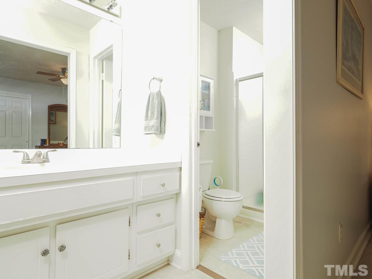 3134 Morningside Drive Raleigh, NC 27607 - Photo 15 of 22 a bathroom with a sink a toilet and shower