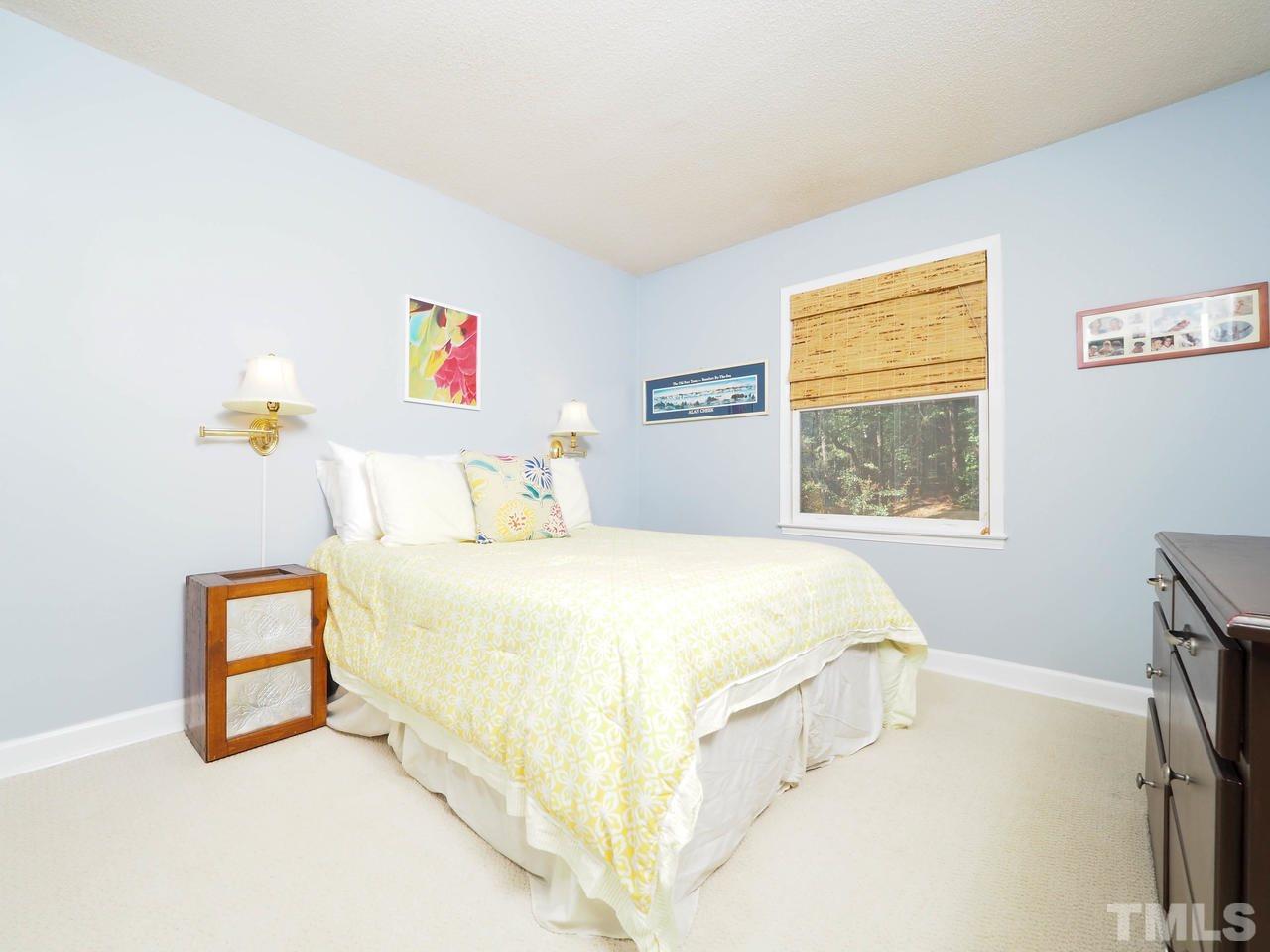 3134 Morningside Drive Raleigh, NC 27607 - Photo 16 of 22 a spacious bedroom with a bed and a window