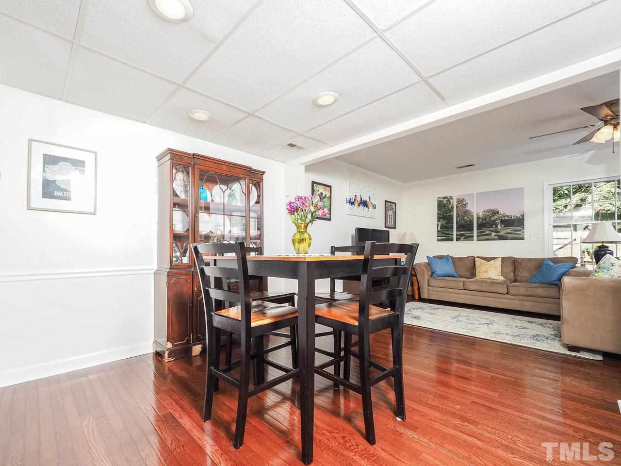3134 Morningside Drive Raleigh, NC 27607 - Photo 8 of 22 a view of a dining room with furniture window and wooden floor