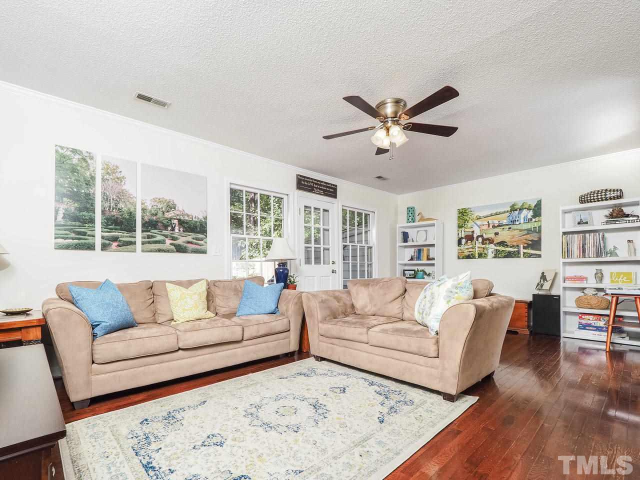 3134 Morningside Drive Raleigh, NC 27607 - Photo 10 of 22 a living room with furniture and a large window
