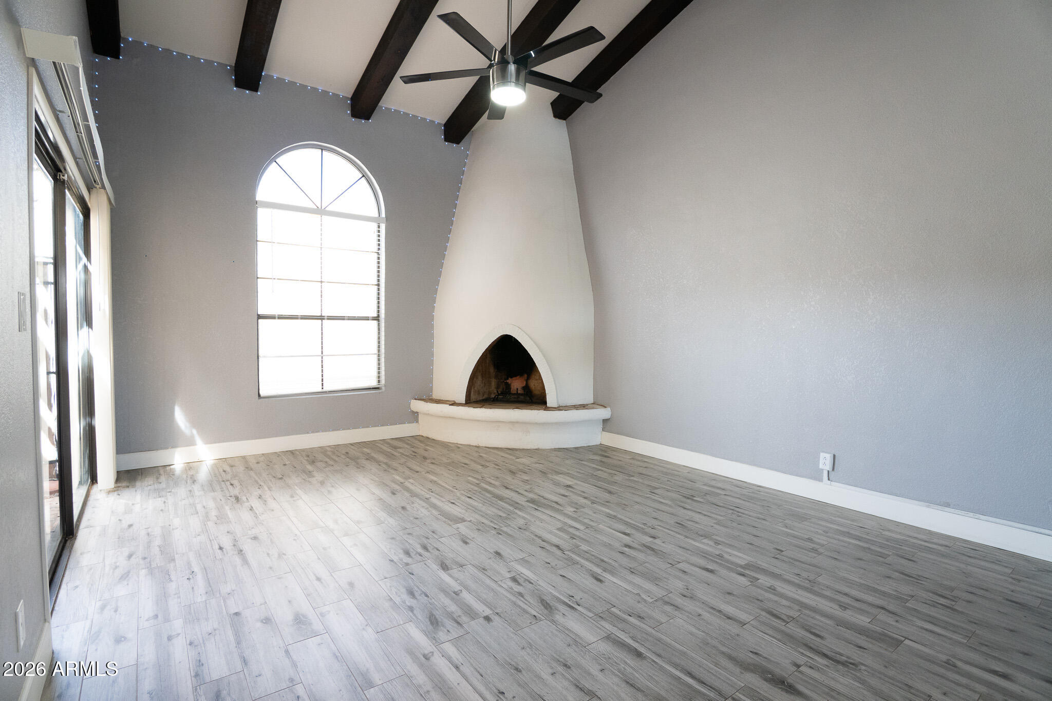 5100 North Miller Road, Unit 3 Scottsdale, AZ 85250 - Photo 6 of 31 an empty room with wooden floor and windows