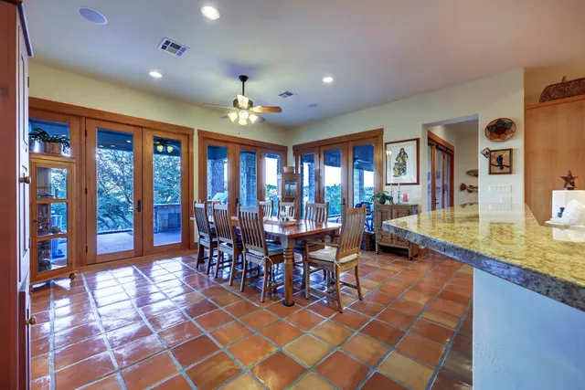 a view of a dining room and hall with furniture