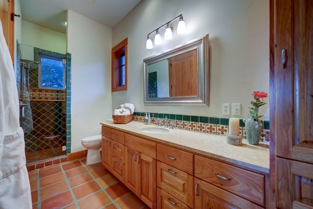 a spacious bathroom with a sink and a mirror