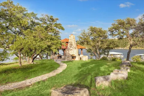a view of a backyard with sitting area