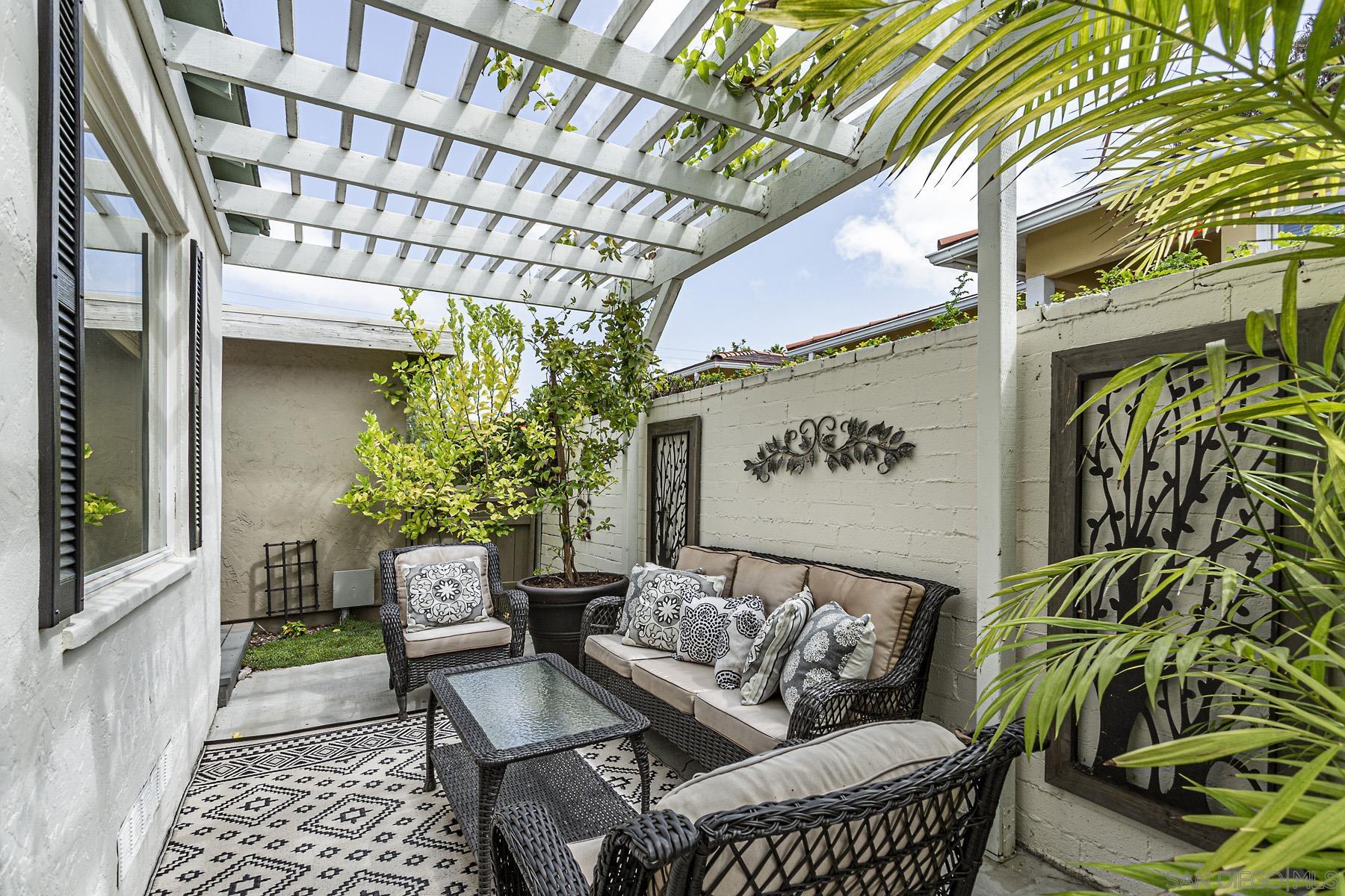 a view of a chairs and table in the patio