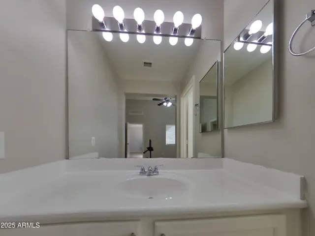 a view of an empty room and a window