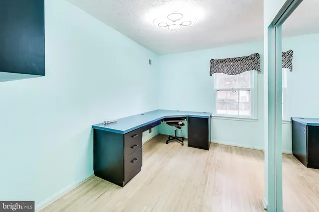 a room with a bed and a flat screen tv