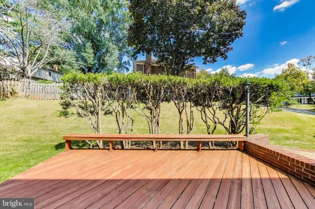 a view of a house with pool and wooden floor