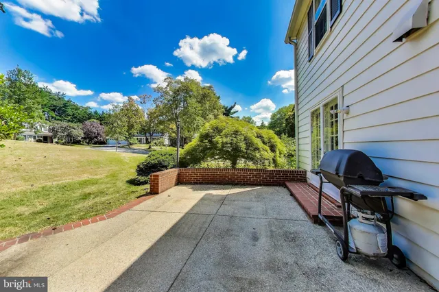 a front view of a house with sitting area