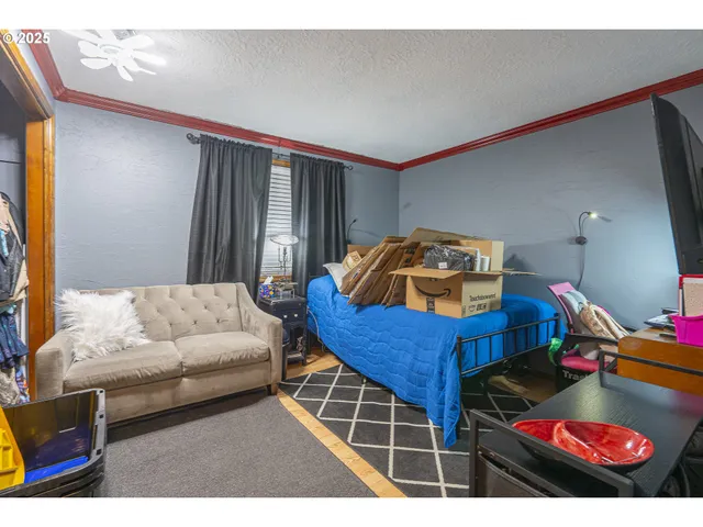 a bedroom with a bed a closet and book shelf