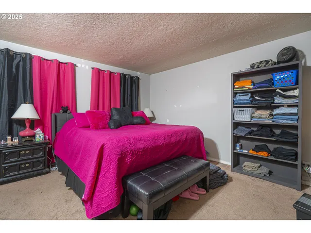 a bathroom with a toilet a sink a mirror and vanity