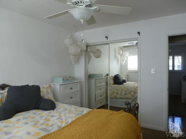2239 Ralston Street Simi Valley, CA 93063 - Photo 22 of 29 a bedroom with a bed and large mirror