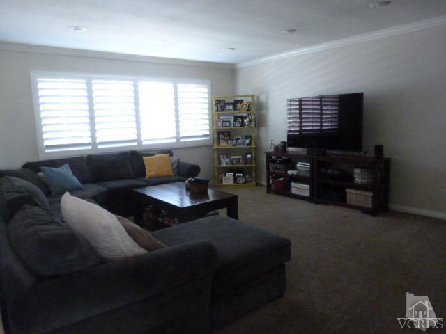 2239 Ralston Street Simi Valley, CA 93063 - Photo 4 of 29 a living room with furniture and a flat screen tv