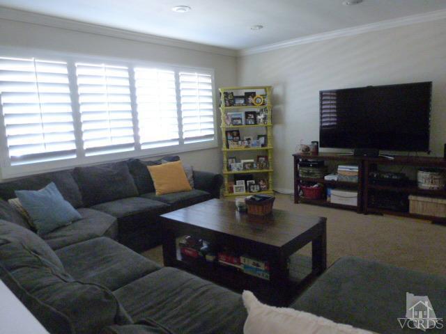 2239 Ralston Street Simi Valley, CA 93063 - Photo 5 of 29 a living room with furniture and a flat screen tv