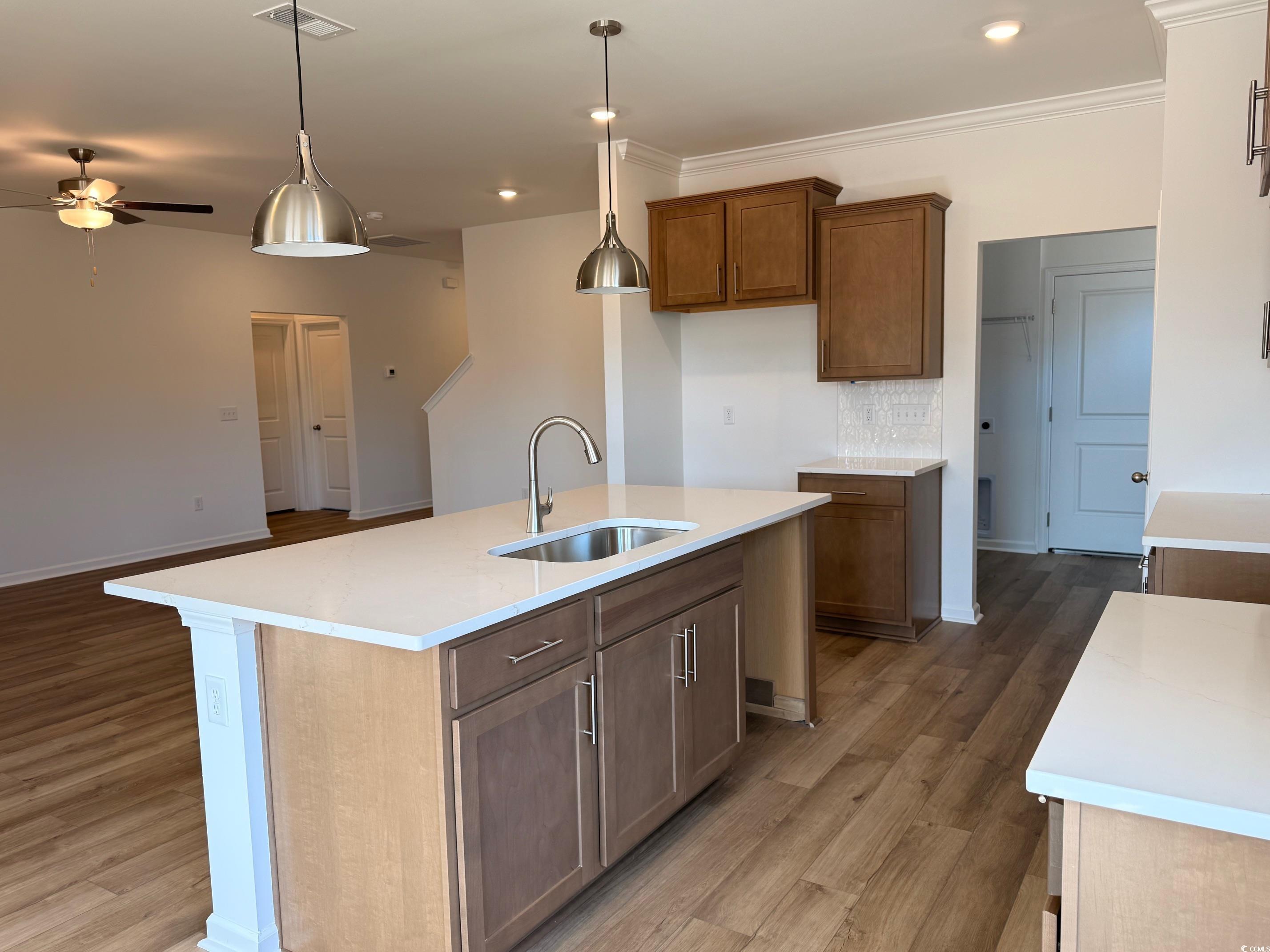 118 Cascade Drive Conway, SC 29527 - Photo 3 of 15 Beautiful Kitchen with decorative light fixtures, island & quartz counter tops.