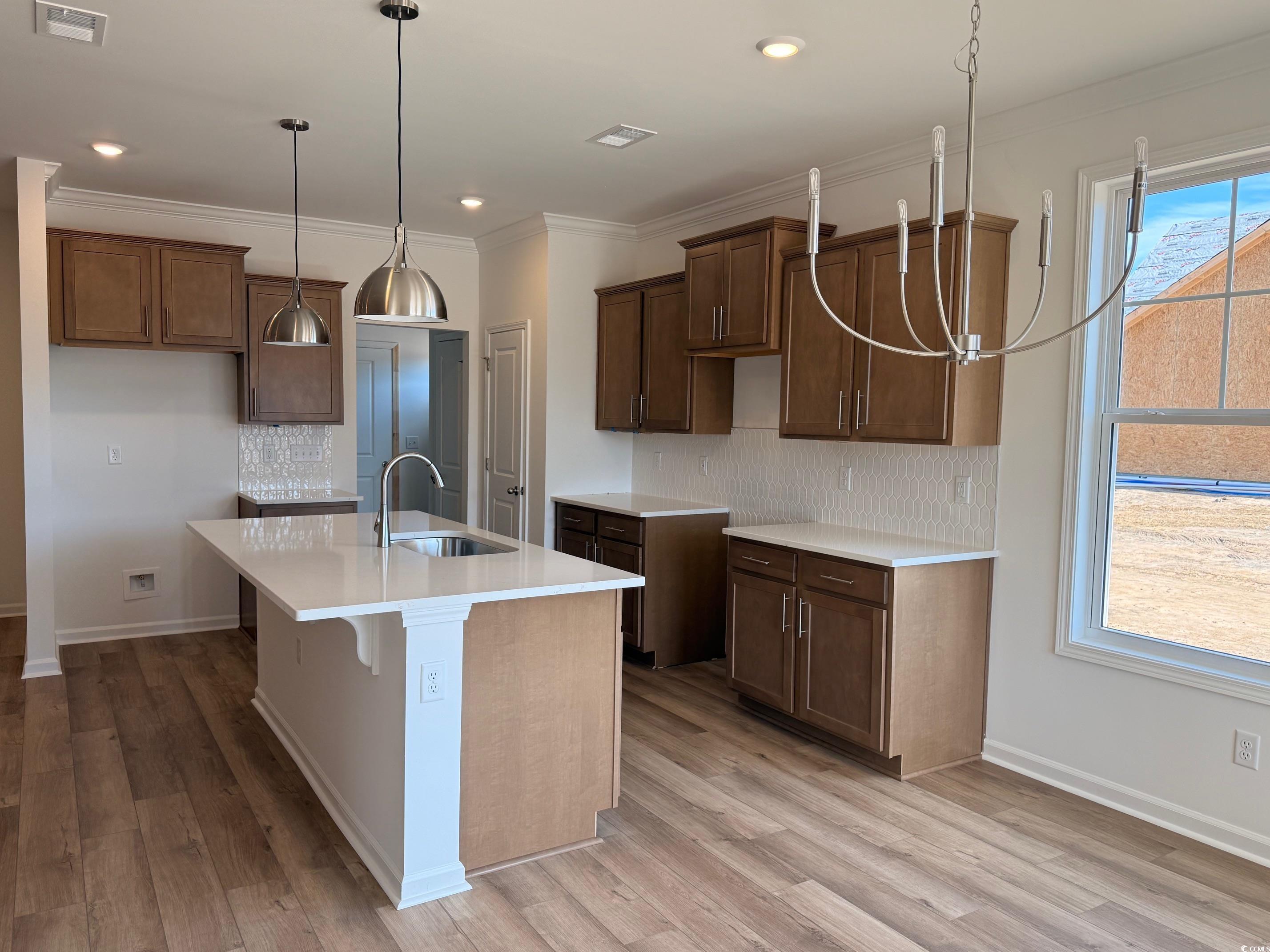 118 Cascade Drive Conway, SC 29527 - Photo 4 of 15 Beautiful Kitchen with decorative light fixtures, island & quartz counter tops.