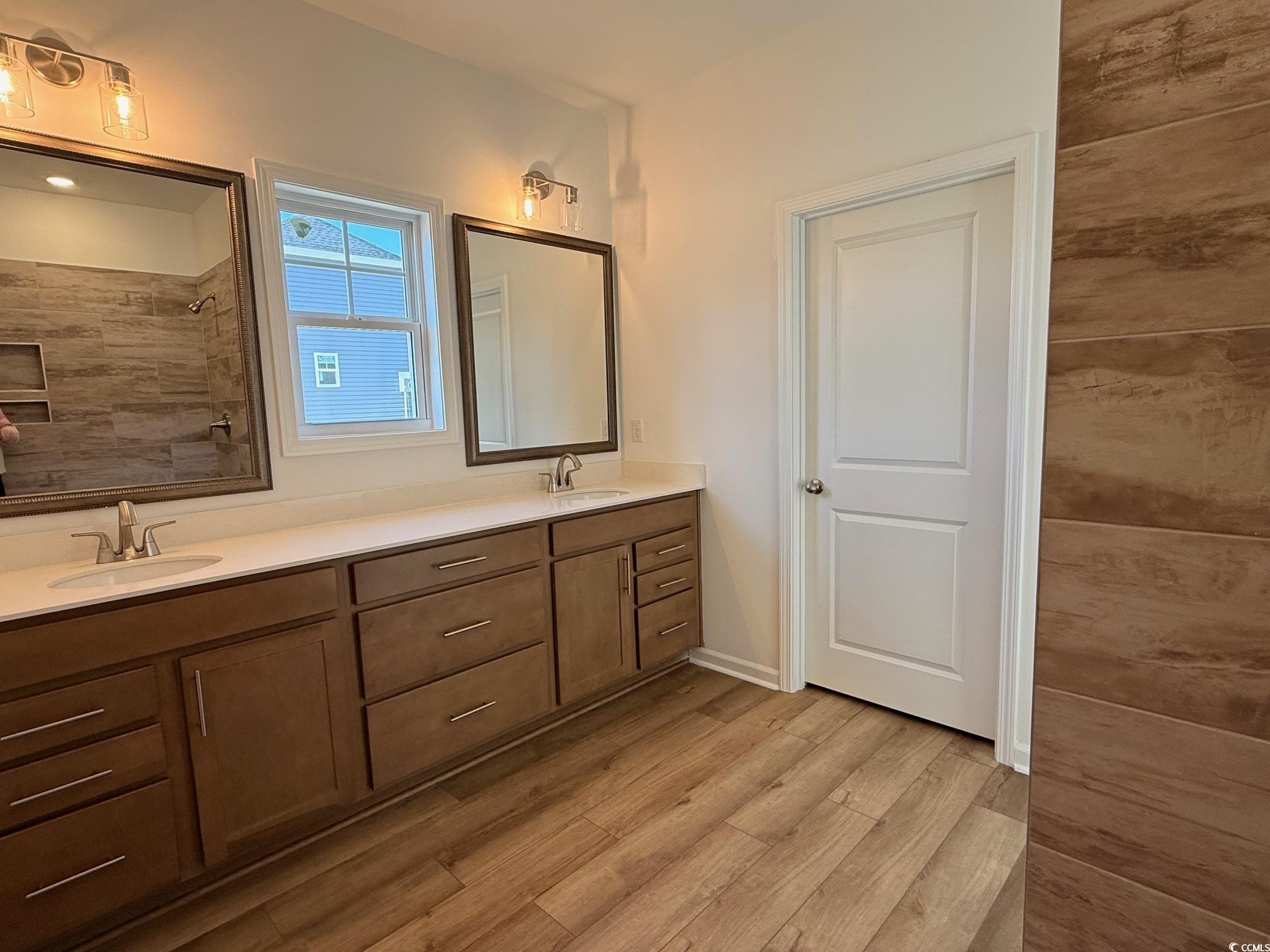 118 Cascade Drive Conway, SC 29527 - Photo 7 of 15 Full bathroom with double vanity, framed mirrors & light and tile shower.