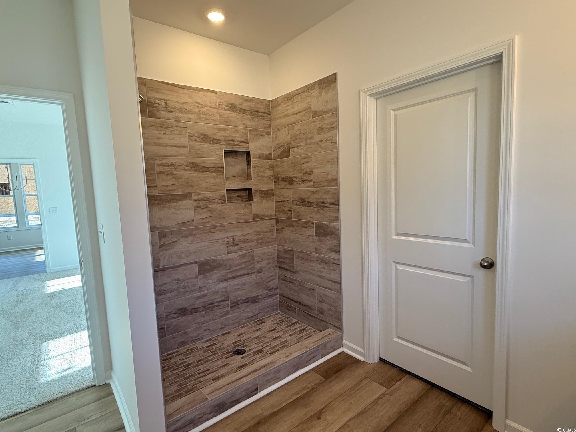 118 Cascade Drive Conway, SC 29527 - Photo 8 of 15 Full bathroom with double vanity, framed mirrors & light and tile shower.
