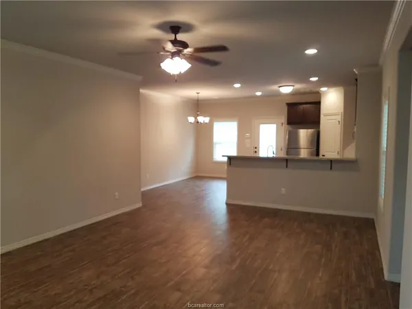 a view of an empty room with stairs