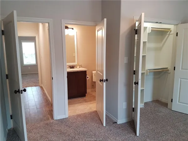 a view of a bathroom with a tub shower and sink