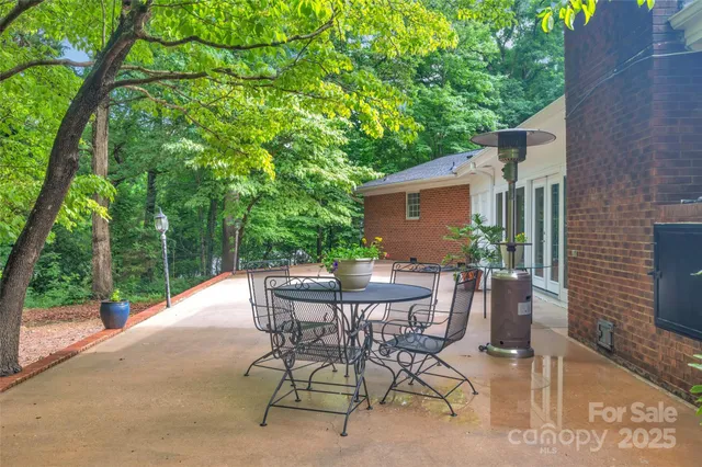 a view of a chair and table in patio of the house