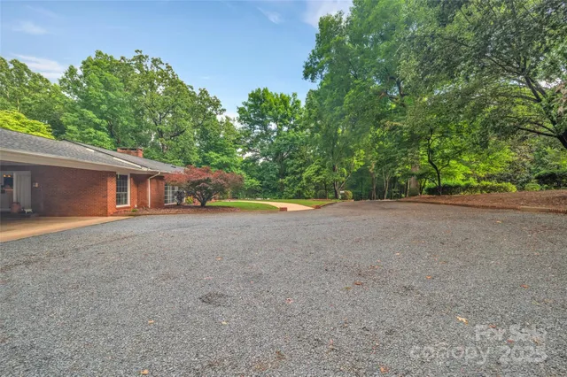 a view of a house with a yard and garage