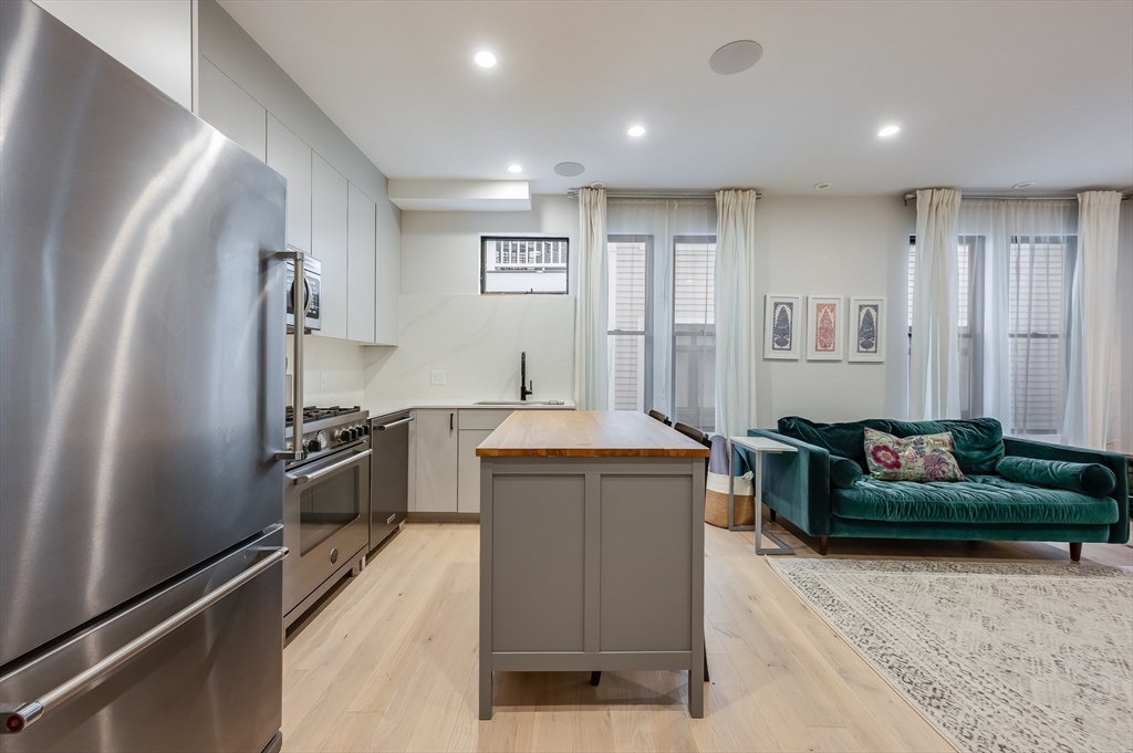 340 West 2nd Street, Unit 5 Boston, MA 02127 - Photo 11 of 25 a living room with furniture and a flat screen tv