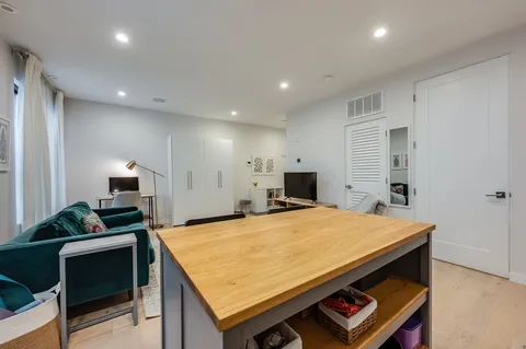 a room with furniture and a flat screen tv