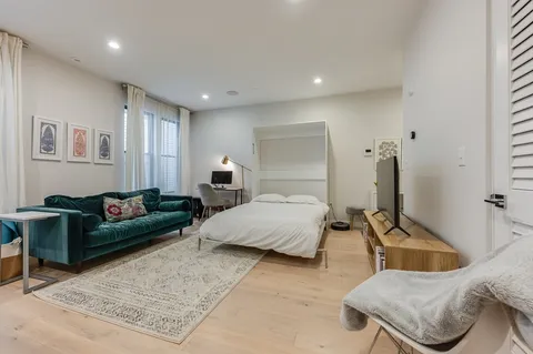 a bedroom with furniture and a couch