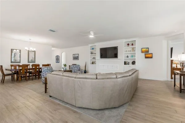 a kitchen with stainless steel appliances granite countertop a sink a stove and refrigerator
